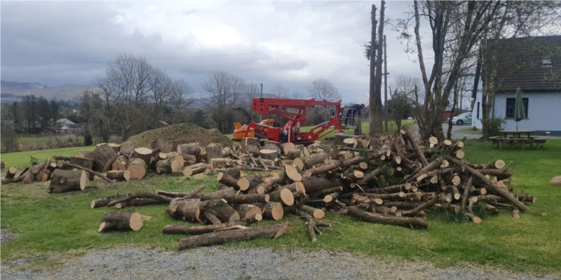 Onsite tree shredding service using wood chipper after tree cutting. PJ Services, Sligo, Ireland removes all waste in a safe and eco-friendly way or you can keep the wood for your own use.